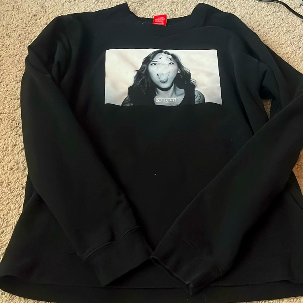 Brand is Visual, large, black.